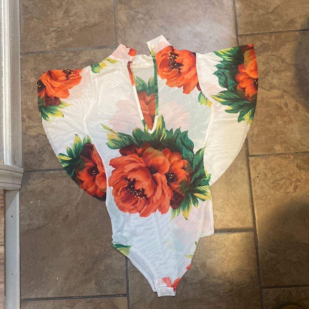 It’s a bodysuit see-through with a beautiful flower print